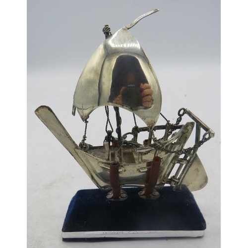 341 - A small silver model of a Chinese junk, on a stand, marked 925. Approx 3