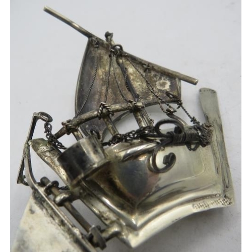 341 - A small silver model of a Chinese junk, on a stand, marked 925. Approx 3