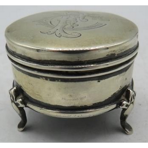 344 - A small silver circular ring box on splayed feet, Chester 1908, monogrammed. Approx weight 32 grams.... 