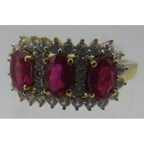 351 - African ruby ring, trilogy of oval faceted rubies of good cut and colour. Overall setting 20mm x 10m... 