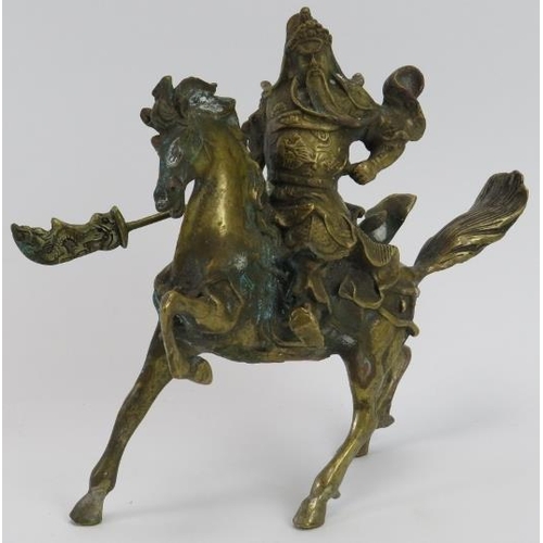 37 - A Chinese solid brass model of a warrior on horseback, 20th century. 18.5 cm height. 
Condition repo... 