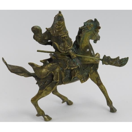 37 - A Chinese solid brass model of a warrior on horseback, 20th century. 18.5 cm height. 
Condition repo... 