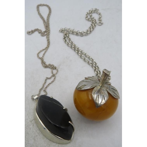 384 - An apple type amber pendant, approx 35mm across, with white metal mounts on a silver 925 chain and a... 