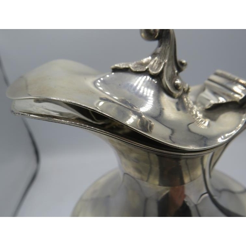 392 - A silver pedestal ewer with ebonised handle, Sheffield 1902. Approx weight 16.5 troy oz/513 grams.
C... 