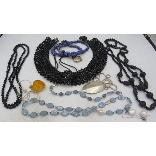 403 - A smokey topaz flattened bead necklace interspersed with blue chalcedony & white metal spacers on a ... 