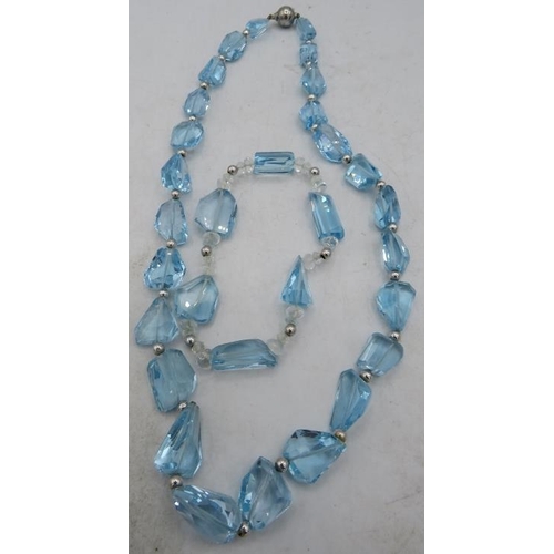 410 - A blue topaz laser cut necklace interspersed with white metal beads with a 925 silver clasp. Approx ... 