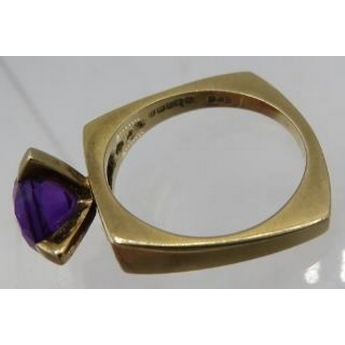 414 - A 9ct gold ring set with centre circular amethyst, approx 8mm across, size M and a 22ct gold wedding... 