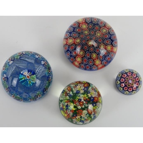 42 - A group of four millefiori glass paperweights, 20th century. Comprising a Vetreria 3 Fiori of Murano... 