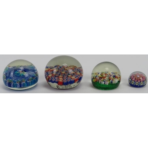 42 - A group of four millefiori glass paperweights, 20th century. Comprising a Vetreria 3 Fiori of Murano... 