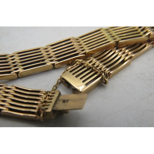 423 - A 15ct yellow gold six bar bracelet on a safety chain. Approx weight 26.8 grams.
Condition report: S... 