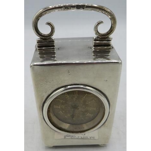 429 - A small silver cased travelling clock on ball feet, London 1895. Approx 3