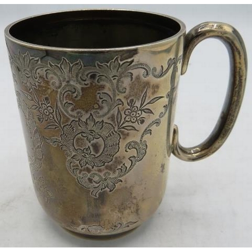 433 - A silver christening mug with 'C' shaped handle and foliate engraved decoration, monogrammed, Sheffi... 