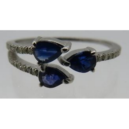 454 - A silver trident style expandable size ring set with three pear shaped sapphire and round cut diamon... 