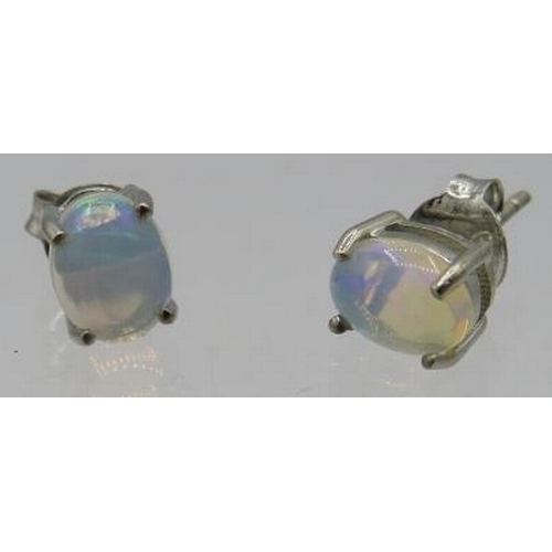 459 - A pair of oval cabochon white Ethiopian opal earrings, marked 925. Approx weight 1.5 grams.
Conditio... 