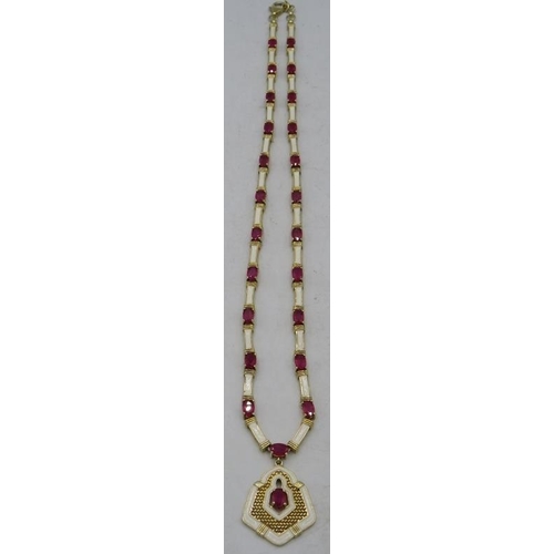 461 - A silver gilt ruby & white enamel necklace with a matching pendant, marked 925. Rubies approx 12cts ... 