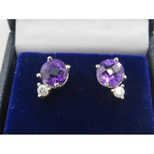 462 - A pair of 14ct white gold stud earrings set with rose cut round amethysts & RBC diamonds. Amethysts ... 