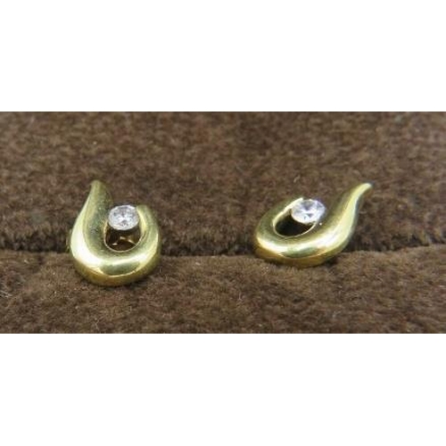 490 - A pair of 9ct yellow gold earrings each set with a white stone, boxed. Approx weight 1.9 grams.
Cond... 