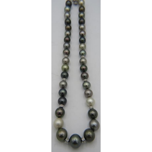 493 - An AAAA quality 'peacock' Tahitian Southsea pearl necklace with radiant lustre and set with 8 diamon... 