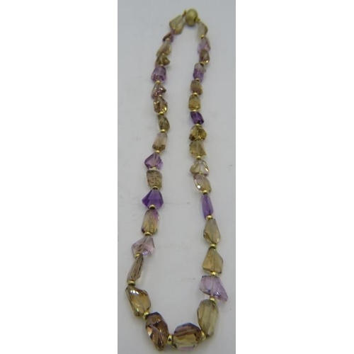 494 - An amethyst & citrine laser cut necklace interspersed with small yellow metal beads, 14ct gold ball ... 