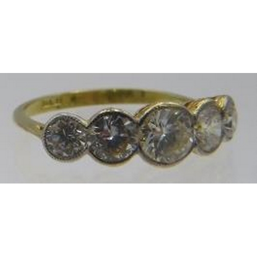 496 - An 18ct yellow gold five stone graduated collet set brilliant cut diamond ring, size N/O. Centre dia... 