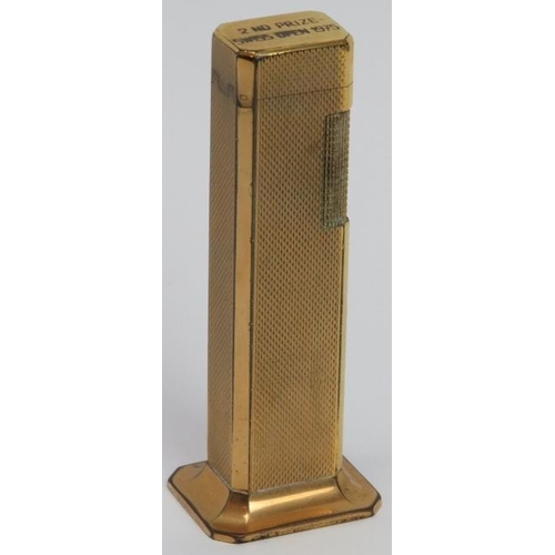 50 - A vintage Dunhill ‘Tallboy’ desktop lighter from the Swiss Open golf tournament, dated 1975. Gilt an... 