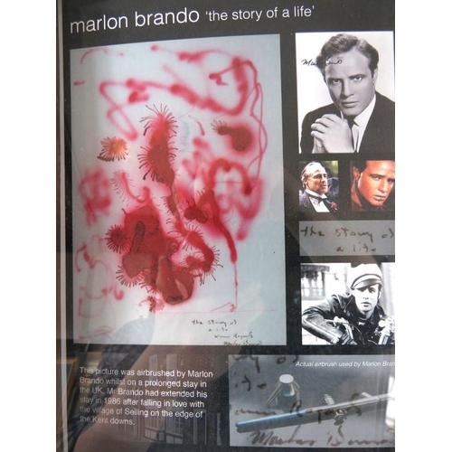 600 - Marlon Brando (Actor) - A framed and glazed compilation an air brush artwork, 'The Story of a Life' ... 