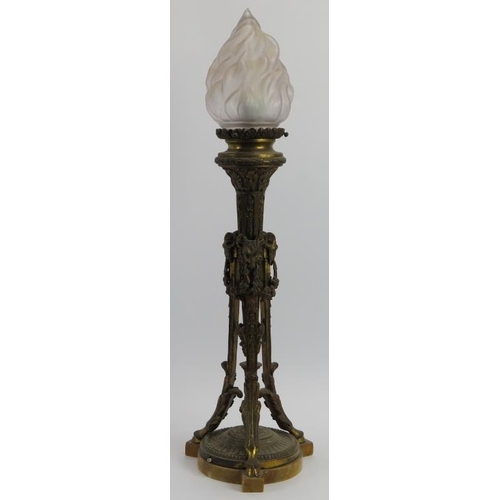 61 - A large gilt bronze triform table lamp, late 19th/early 20th century. Decorated with rams heads mask... 