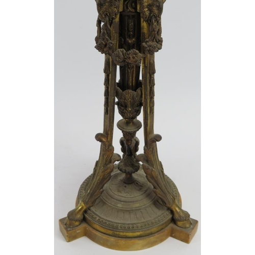 61 - A large gilt bronze triform table lamp, late 19th/early 20th century. Decorated with rams heads mask... 