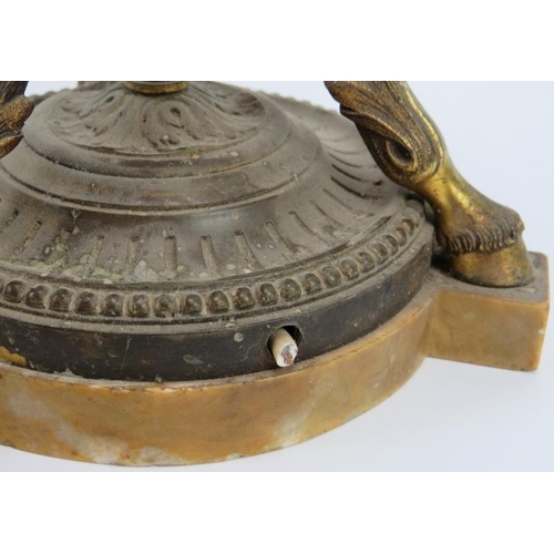 61 - A large gilt bronze triform table lamp, late 19th/early 20th century. Decorated with rams heads mask... 