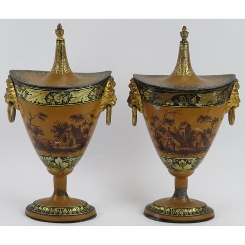 62 - A pair of Tole Peinte japanned tin chestnut urns, early 19th century. Decorated with hand painted ru... 