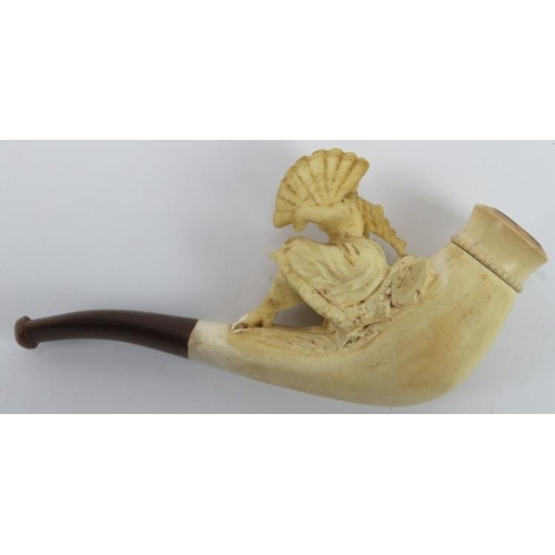 65 - A Meerschaum carved cheroot holder, 19th century. Surmounted with a lady holding a fan. 10.9 cm leng... 