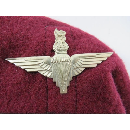 69 - Militaria: A WWII British Airborne Forces Maroon Beret, dated 1943. With a white metal badge, leathe... 