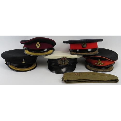 70 - Militaria: A group of vintage British military Army and Navy peaked caps and a side hat. (6 items).
... 