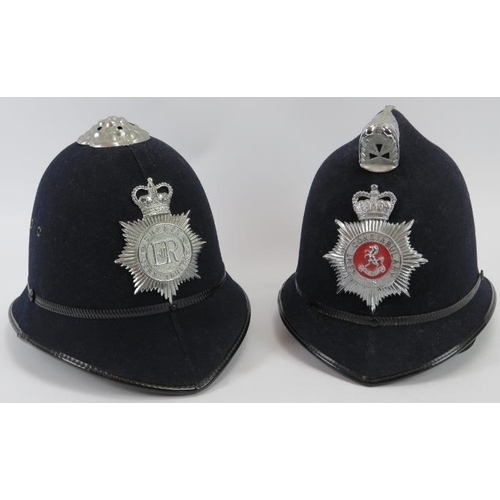 73 - Two vintage British Police helmets, 20th century. Sussex and Kent Constabulary. (2 items).
Condition... 