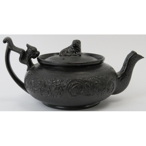 76 - A rare English basalt ceramic teapot, 19th century. 18 cm length.
Condition report: Very small chips... 