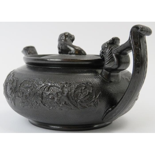 76 - A rare English basalt ceramic teapot, 19th century. 18 cm length.
Condition report: Very small chips... 