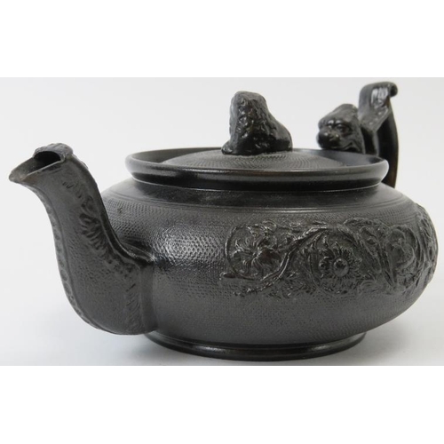 76 - A rare English basalt ceramic teapot, 19th century. 18 cm length.
Condition report: Very small chips... 