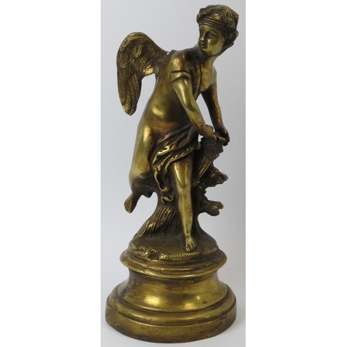 83 - A brass statue of an angel beside a tree stump, probably late 19th/early 20th century. 34 cm height.... 