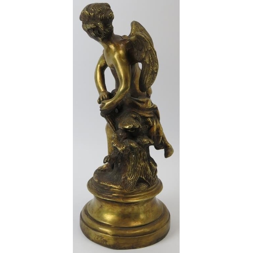 83 - A brass statue of an angel beside a tree stump, probably late 19th/early 20th century. 34 cm height.... 