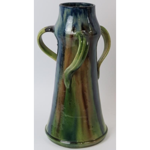 84 - A Belgian drip glazed pottery jug, late 19th/early 20th century. In the form of a flagon with three ... 