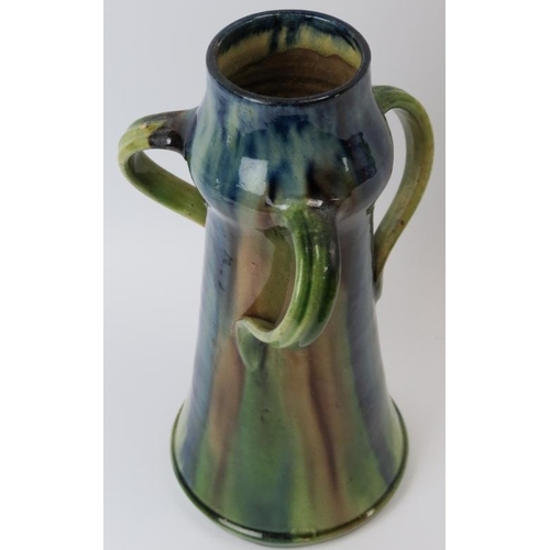 84 - A Belgian drip glazed pottery jug, late 19th/early 20th century. In the form of a flagon with three ... 