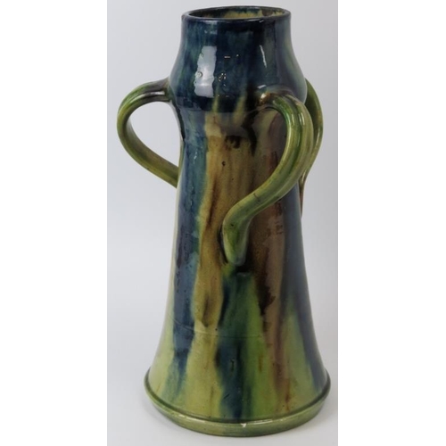 84 - A Belgian drip glazed pottery jug, late 19th/early 20th century. In the form of a flagon with three ... 