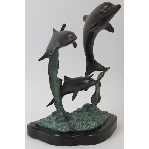 85 - A bronze sculpture depicting dolphins leaping from the water, 20th century. Naturalistically modelle... 