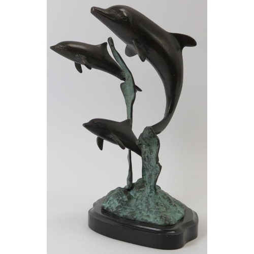 85 - A bronze sculpture depicting dolphins leaping from the water, 20th century. Naturalistically modelle... 