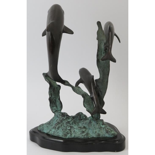 85 - A bronze sculpture depicting dolphins leaping from the water, 20th century. Naturalistically modelle... 