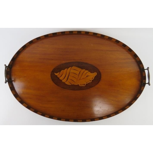 87 - An Edwardian Sheraton Revival twin handled oval tray. The centre marquetry inlaid with a shell pater... 