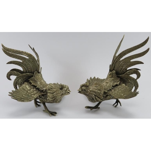 94 - A pair of cast metal table decoration fighting cocks, 20th century. (2 items) 21 cm approximate leng... 