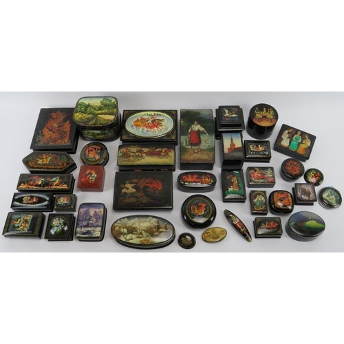 95 - Collection of thirty six Russian lacquer papier Mache boxes, hair slides, brooches, some signed. (36... 