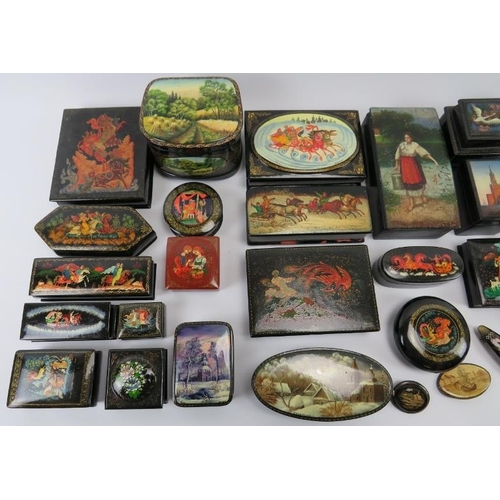 95 - Collection of thirty six Russian lacquer papier Mache boxes, hair slides, brooches, some signed. (36... 