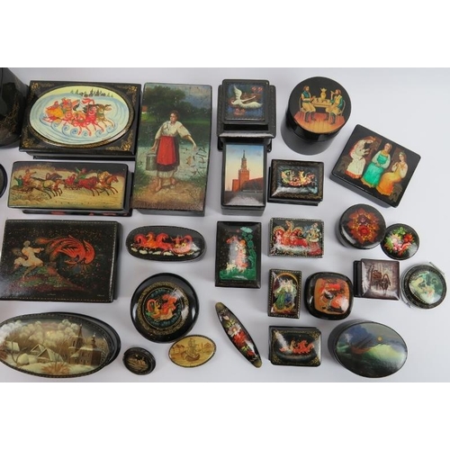 95 - Collection of thirty six Russian lacquer papier Mache boxes, hair slides, brooches, some signed. (36... 